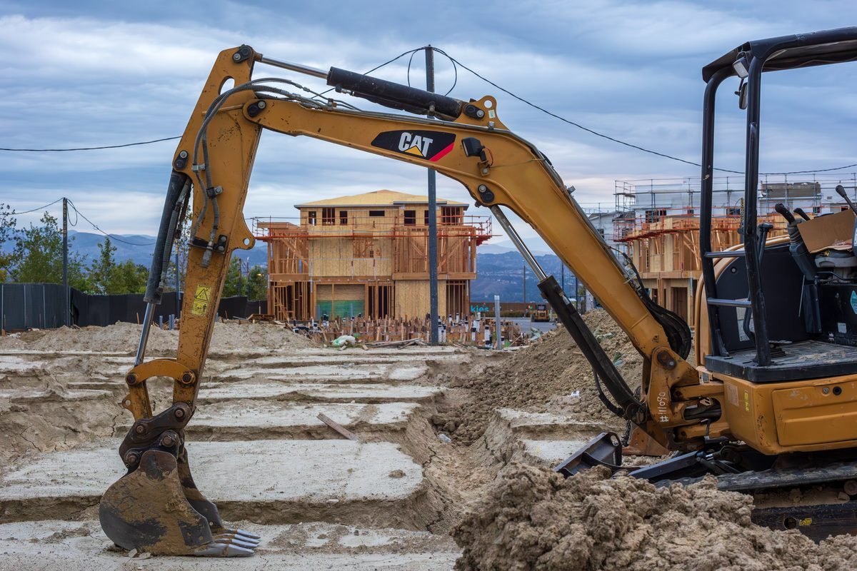 Mini excavator digging on a residential building site